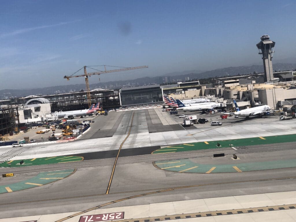 an airport with airplanes on the runway