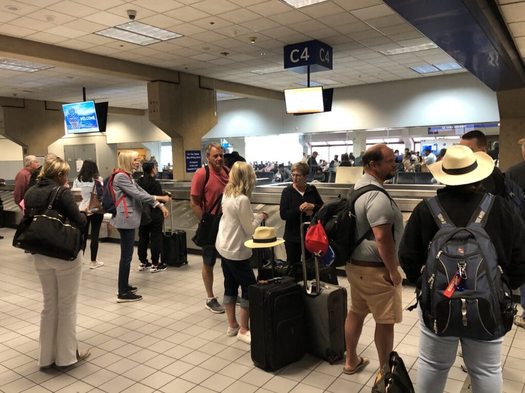 a group of people standing in a terminal