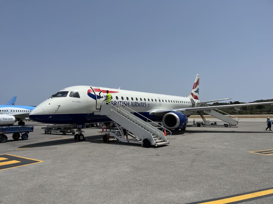 a plane with stairs on the ground