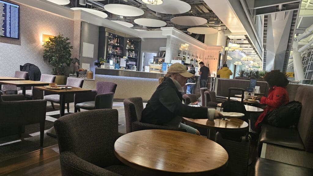 a woman sitting at tables in a restaurant