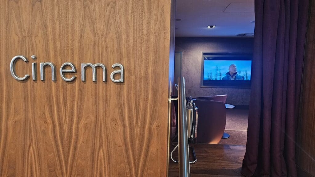 a wooden wall with a sign and a television