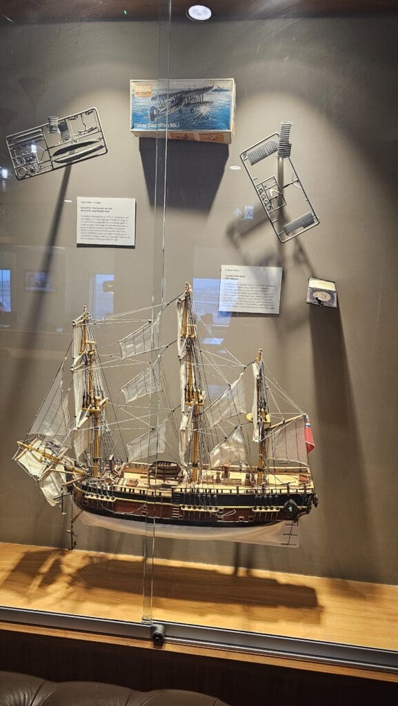 a model of a ship in a glass case