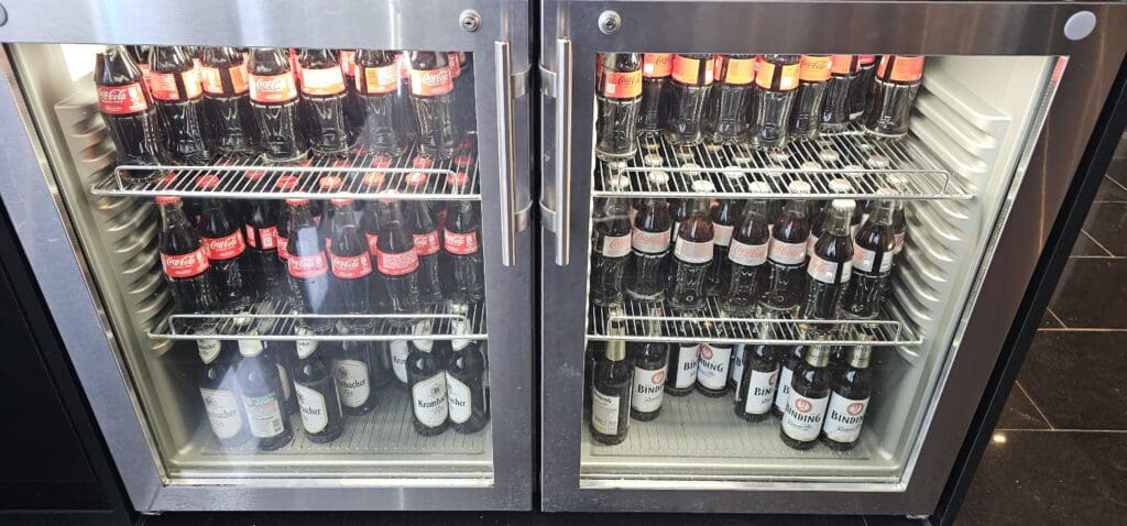 a refrigerator with bottles of beer