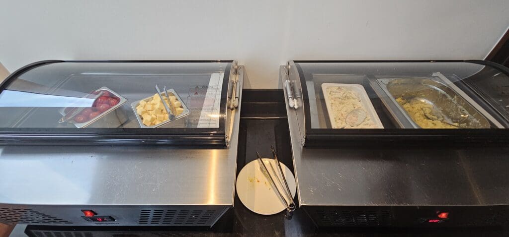 food in a freezer with a tray of food