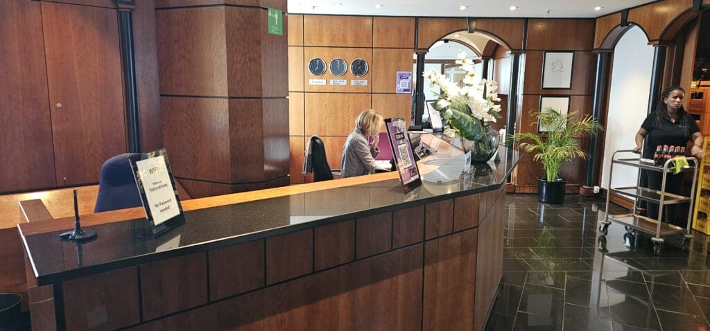 a woman sitting at a reception desk