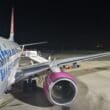 a plane on the runway at night