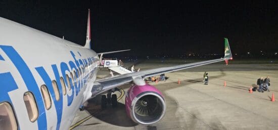 a plane on the runway at night