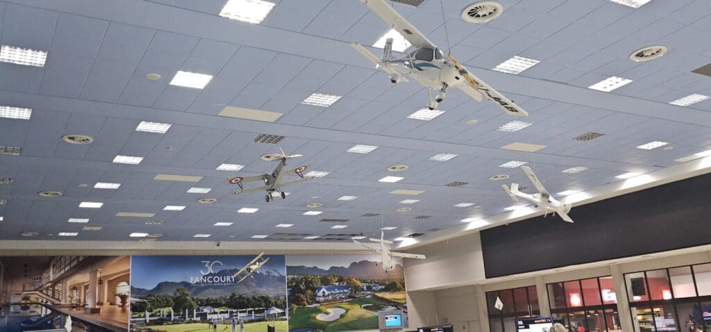 a group of airplanes from the ceiling