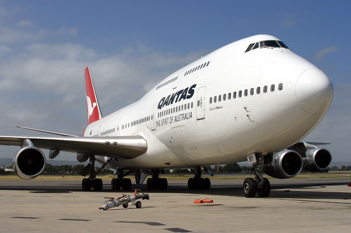 a large white airplane on a runway