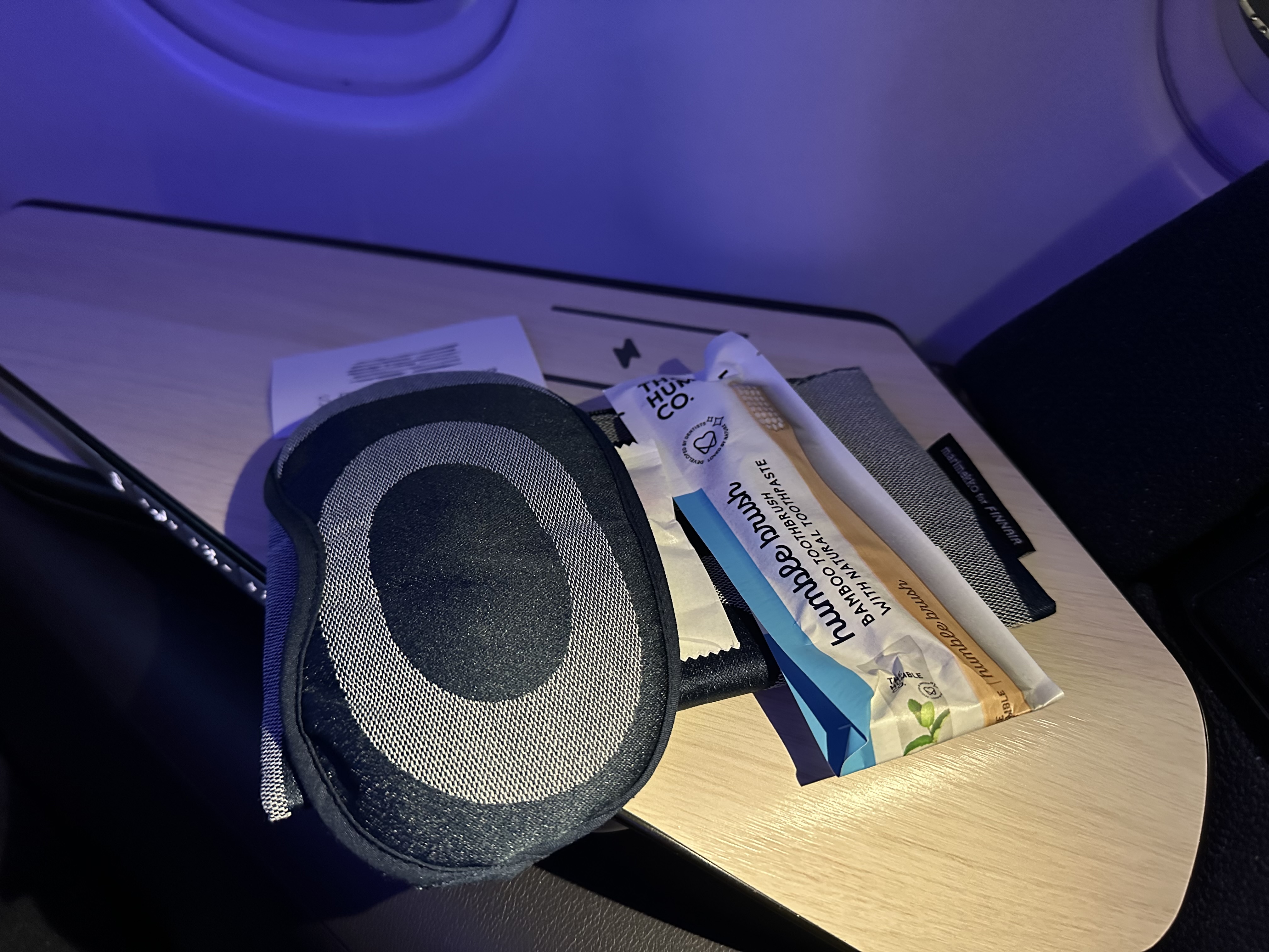 a eye mask and a packet on a table