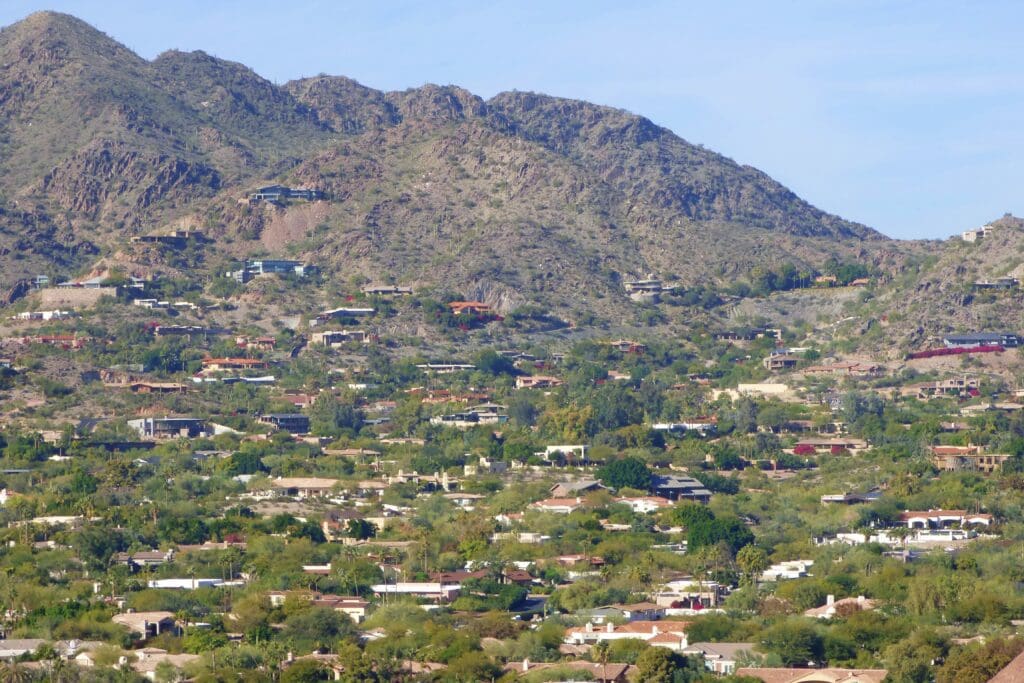 a mountain with houses and trees