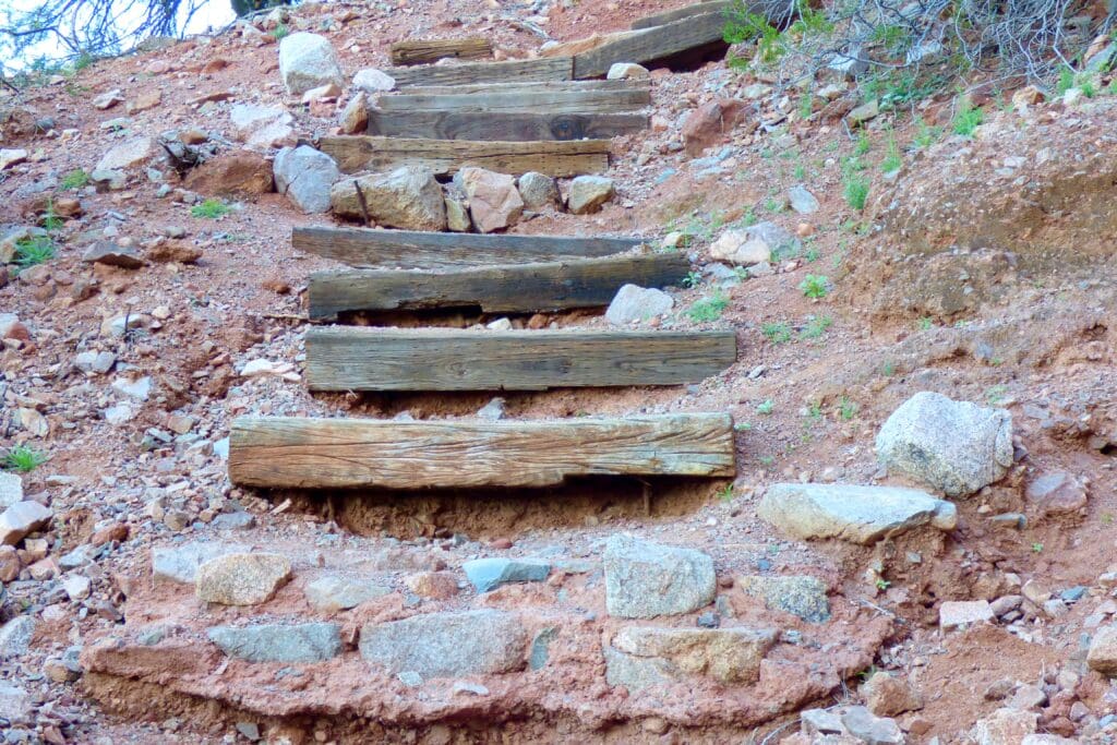 a wooden steps on a rocky hill