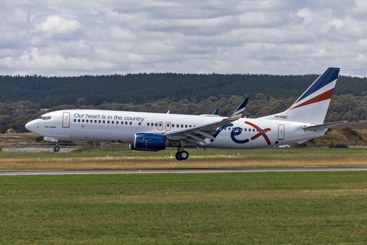 a white airplane on a runway