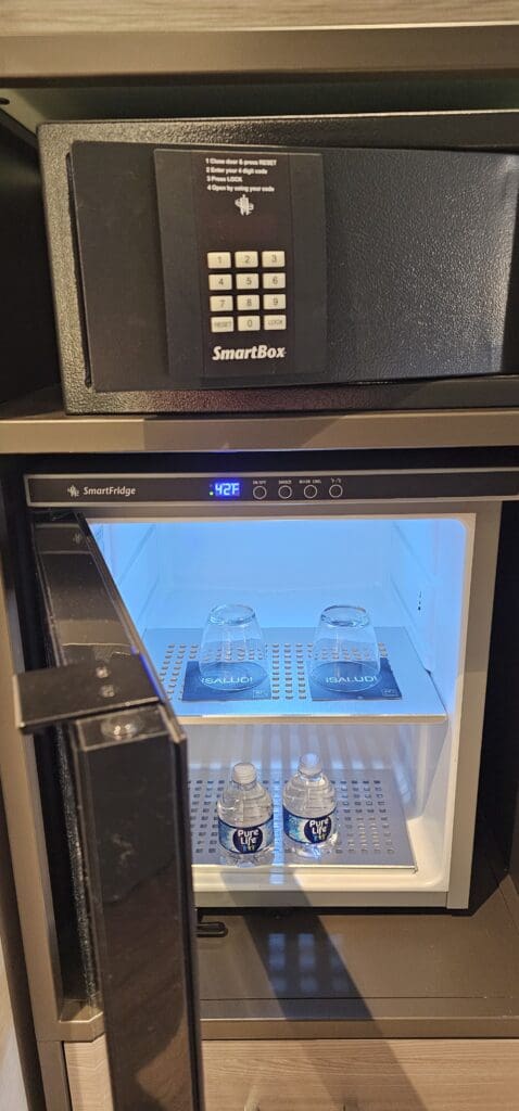 a small refrigerator with a door open