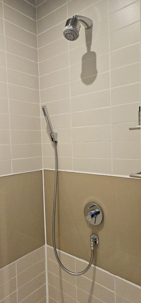 a shower head in a bathroom