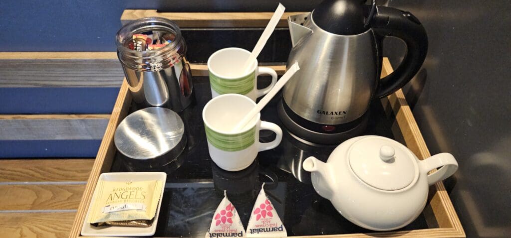 a table with teapots and cups