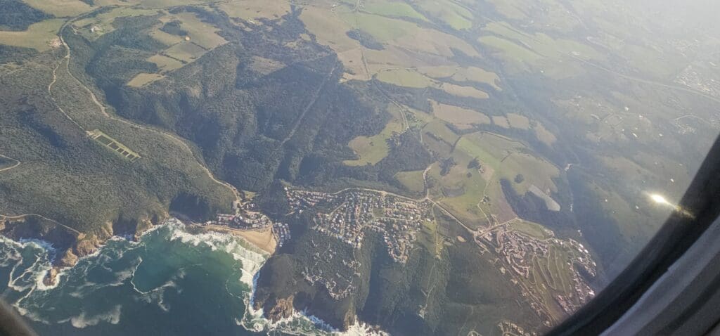 an aerial view of a town and a beach