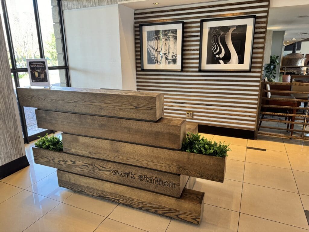 a wood desk in a lobby