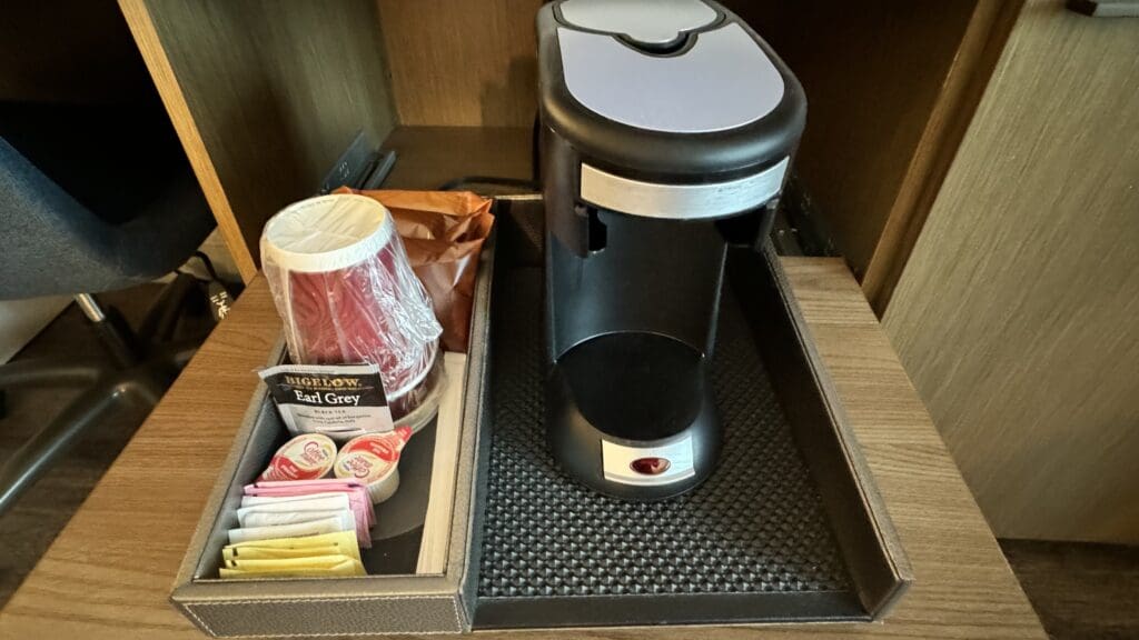 a coffee maker and a container of food