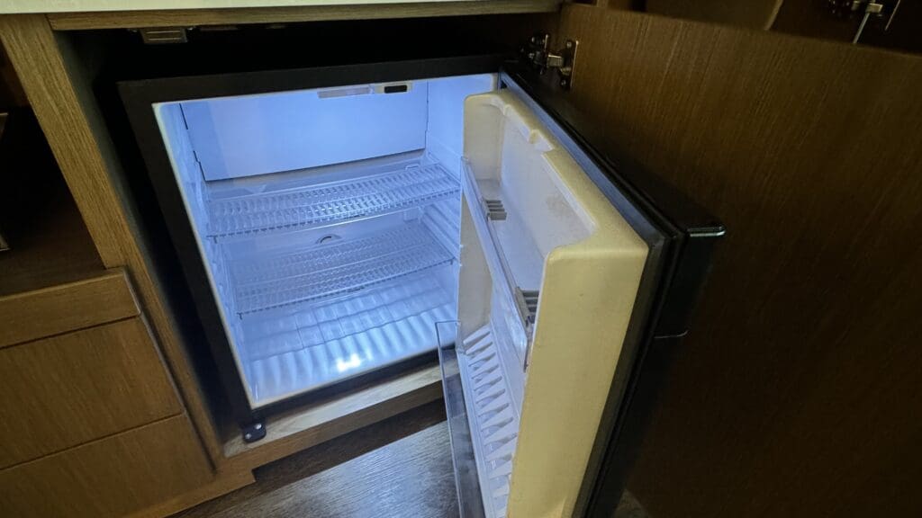 a small refrigerator with a light inside