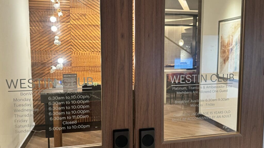 a glass doors with a sign on them