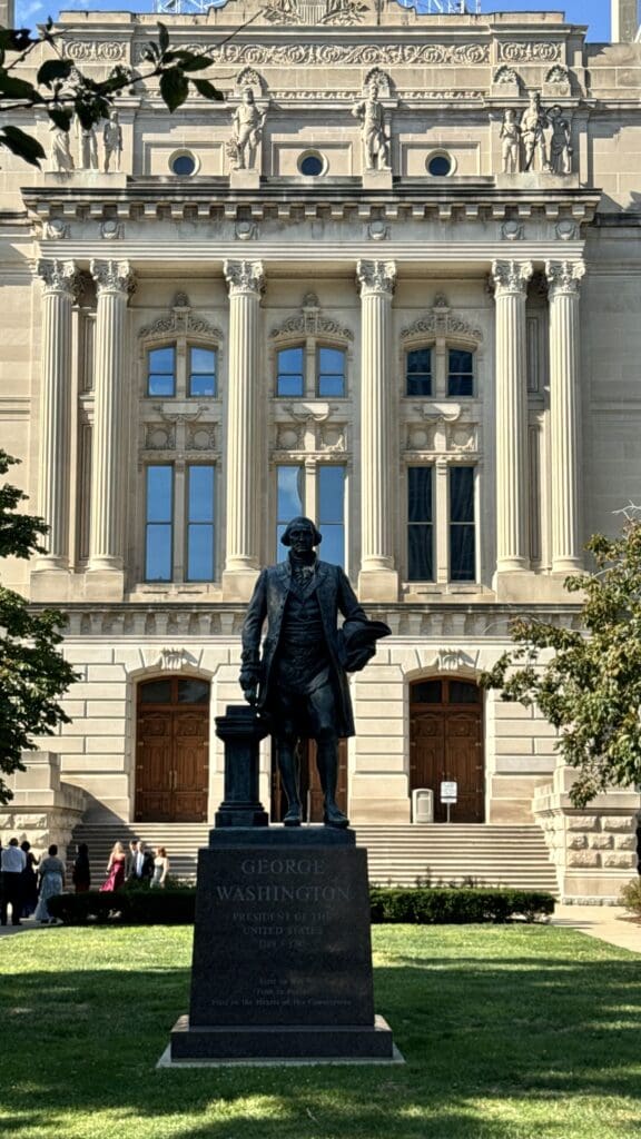 a statue of a man in front of a building