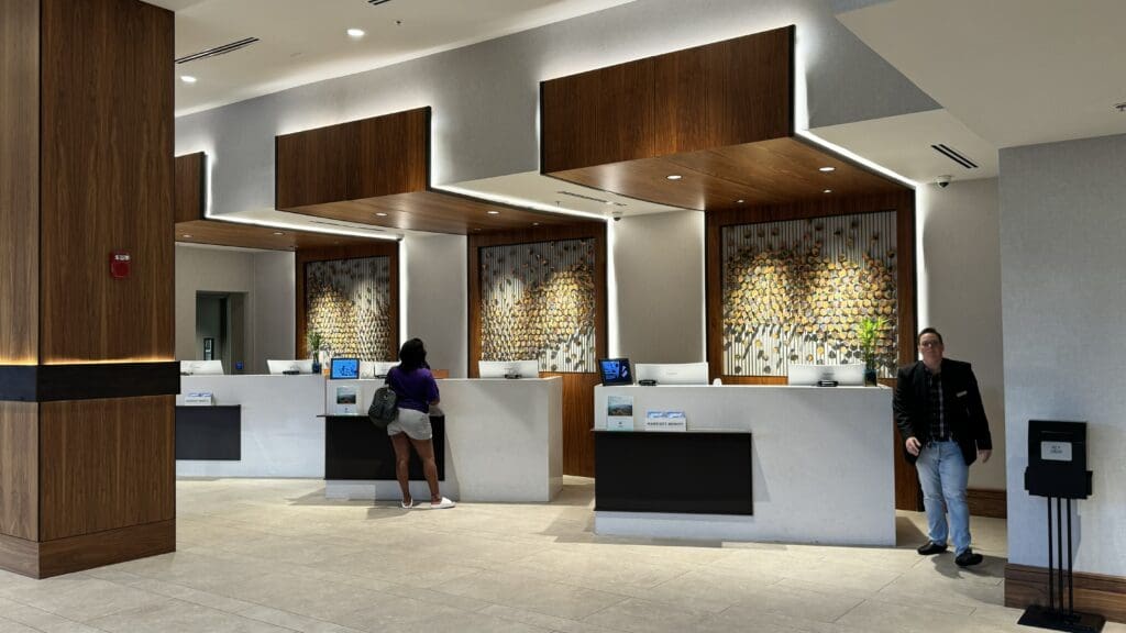 a woman standing at a reception desk