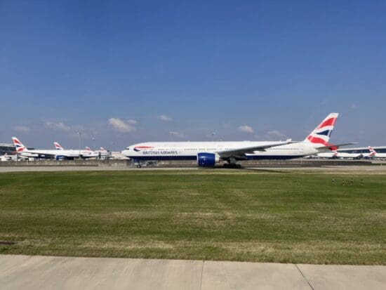 a group of airplanes on a runway