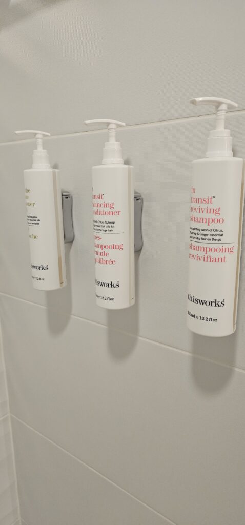 a group of shampoo bottles on a wall