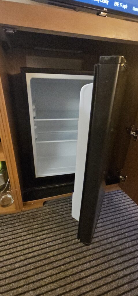 a refrigerator with shelves in it