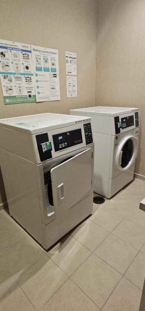 a washing machine and dryer in a room