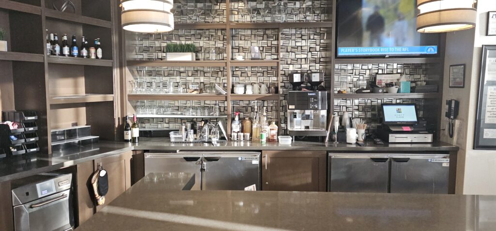 a kitchen with a counter top and shelves