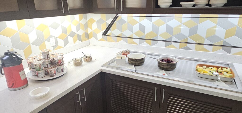 a kitchen with bowls of food on a counter