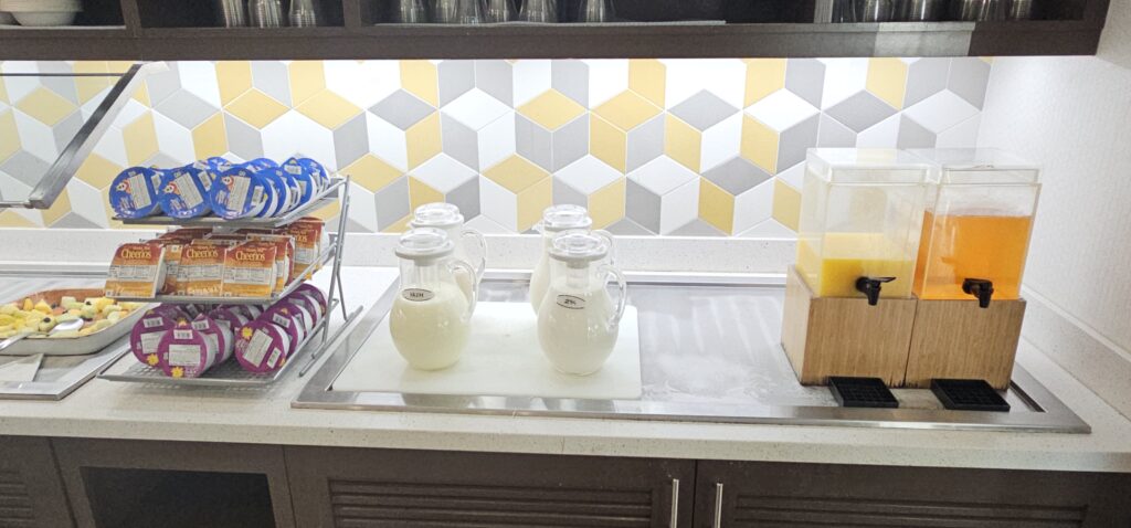 a group of jugs of milk on a counter