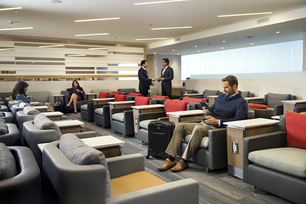 Travelers in an American Airlines Admirals Club