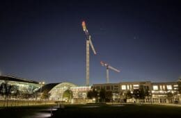 a large crane in front of a building