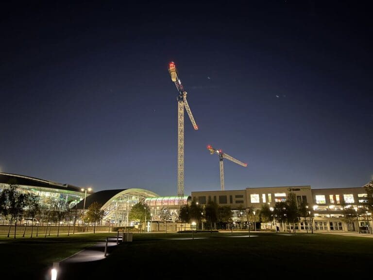 a large crane in front of a building