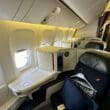 a seat in a plane in Air France 777 Business Class