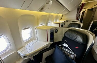 a seat in a plane in Air France 777 Business Class