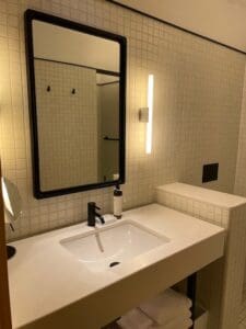 a bathroom with a mirror and sink