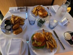 a table with plates of food and cutlery