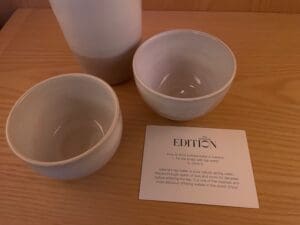 a group of bowls and a cup on a table