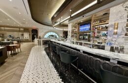 a bar with a counter and chairs