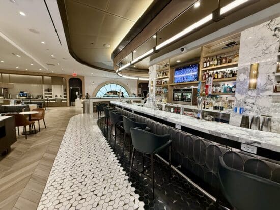 a bar with a counter and chairs