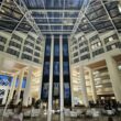 a large building with glass walls and a large ceiling