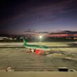 an airplane on a runway at night