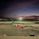 an airplane on a runway at night