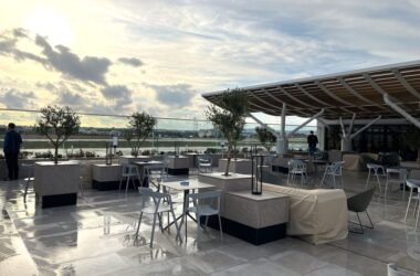 a patio with tables and chairs