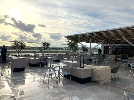 a patio with tables and chairs