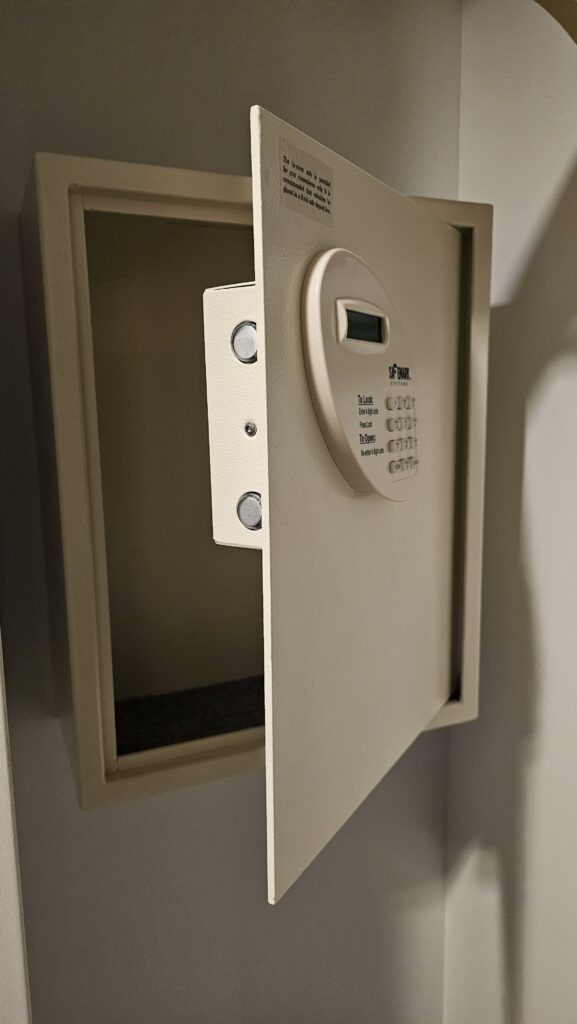 a white safe with a keypad and a digital screen